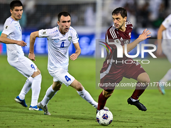 Lucas Mendes (#12) of Qatar battles for the ball with Farrukh Sayfiev (#4) of Uzbekistan during the FIFA World Cup 2026 AFC Asian Qualifiers...