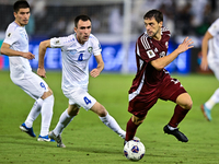 Lucas Mendes (#12) of Qatar battles for the ball with Farrukh Sayfiev (#4) of Uzbekistan during the FIFA World Cup 2026 AFC Asian Qualifiers...