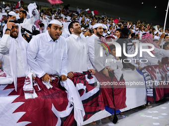 Fans of Qatar celebrate after winning the FIFA World Cup 2026 AFC Asian Qualifiers third round group A match between Qatar and Uzbekistan at...