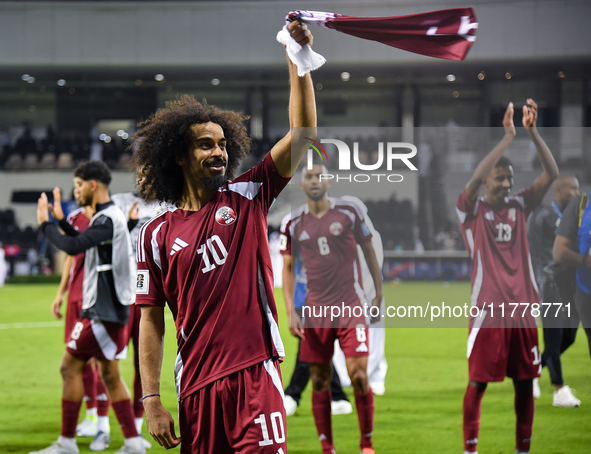 Players of Qatar applaud the fans after winning the FIFA World Cup 2026 AFC Asian Qualifiers third round group A match between Qatar and Uzb...