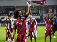 Players of Qatar applaud the fans after winning the FIFA World Cup 2026 AFC Asian Qualifiers third round group A match between Qatar and Uzb...