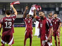 Players of Qatar applaud the fans after winning the FIFA World Cup 2026 AFC Asian Qualifiers third round group A match between Qatar and Uzb...