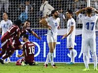 Lucas Mendes (3-L) of Qatar celebrates with his teammates after scoring a goal during the FIFA World Cup 2026 AFC Asian Qualifiers third rou...