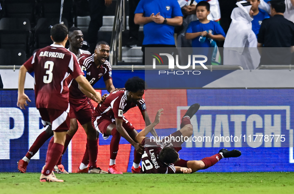 Lucas Mendes (bottom) of Qatar celebrates with his teammates after scoring the goal during the FIFA World Cup 2026 AFC Asian Qualifiers thir...