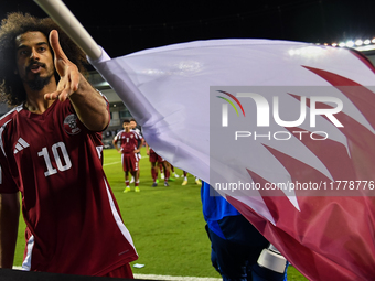 Akram Afif of Qatar celebrates after winning the FIFA World Cup 2026 AFC Asian Qualifiers third round group A match between Qatar and Uzbeki...