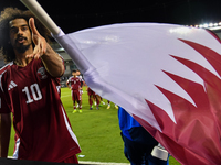 Akram Afif of Qatar celebrates after winning the FIFA World Cup 2026 AFC Asian Qualifiers third round group A match between Qatar and Uzbeki...