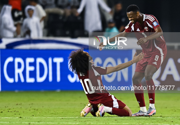 Akram Afif (C) (L) of Qatar and Mohammed Muntari (R) of Qatar celebrate after winning the FIFA World Cup 2026 AFC Asian Qualifiers third rou...