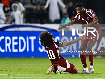 Akram Afif (C) (L) of Qatar and Mohammed Muntari (R) of Qatar celebrate after winning the FIFA World Cup 2026 AFC Asian Qualifiers third rou...