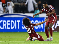 Akram Afif (C) (L) of Qatar and Mohammed Muntari (R) of Qatar celebrate after winning the FIFA World Cup 2026 AFC Asian Qualifiers third rou...