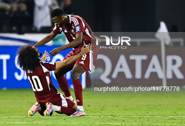 Akram Afif (C) (L) of Qatar and Mohammed Muntari (R) of Qatar celebrate after winning the FIFA World Cup 2026 AFC Asian Qualifiers third rou...