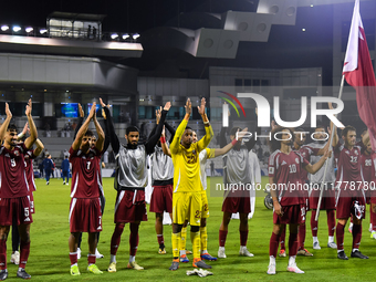 Players of Qatar applaud the fans after winning the FIFA World Cup 2026 AFC Asian Qualifiers third round group A match between Qatar and Uzb...