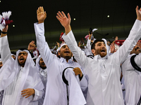 Fans of Qatar celebrate after winning the FIFA World Cup 2026 AFC Asian Qualifiers third round group A match between Qatar and Uzbekistan at...