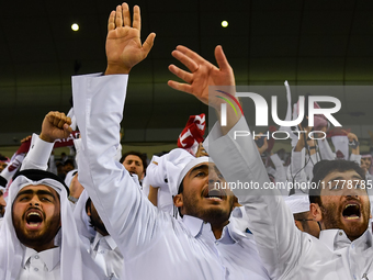 Fans of Qatar celebrate after winning the FIFA World Cup 2026 AFC Asian Qualifiers third round group A match between Qatar and Uzbekistan at...