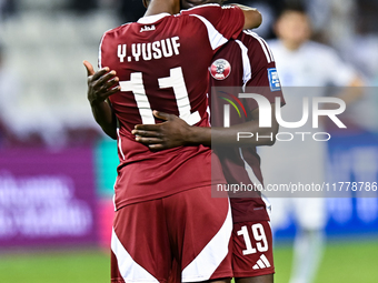 Almoez Ali (R) and Yusuf Abdurisag (L) of Qatar celebrate after they win the FIFA World Cup 2026 AFC Asian Qualifiers third round group A ma...