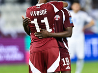 Almoez Ali (R) and Yusuf Abdurisag (L) of Qatar celebrate after they win the FIFA World Cup 2026 AFC Asian Qualifiers third round group A ma...