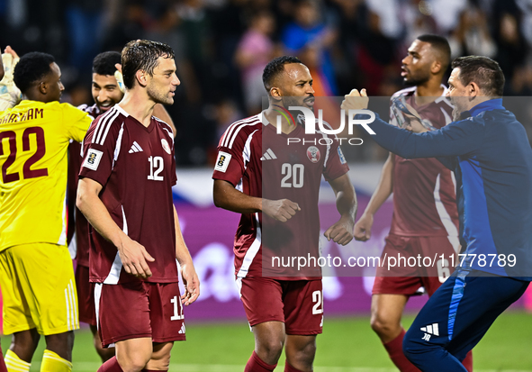 Lucas Mendes (L) and Ahmed Fathy (C) of Qatar celebrate after winning the FIFA World Cup 2026 AFC Asian Qualifiers third round group A match...