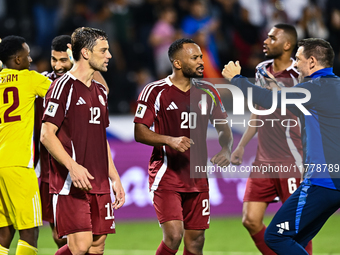 Lucas Mendes (L) and Ahmed Fathy (C) of Qatar celebrate after winning the FIFA World Cup 2026 AFC Asian Qualifiers third round group A match...