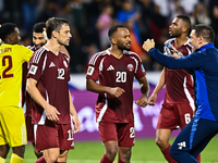 Lucas Mendes (L) and Ahmed Fathy (C) of Qatar celebrate after winning the FIFA World Cup 2026 AFC Asian Qualifiers third round group A match...