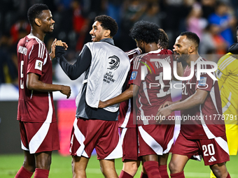 Players of Qatar celebrate after they win the FIFA World Cup 2026 AFC Asian Qualifiers third round group A match between Qatar and Uzbekista...