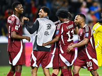 Players of Qatar celebrate after they win the FIFA World Cup 2026 AFC Asian Qualifiers third round group A match between Qatar and Uzbekista...