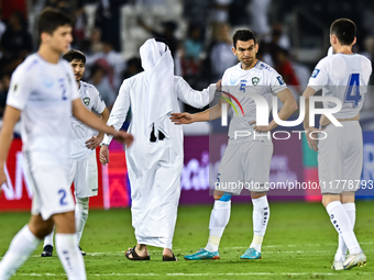 Uzbekistan players show their dejection after the FIFA World Cup 2026 AFC Asian Qualifiers third round group A match between Qatar and Uzbek...