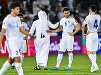 Uzbekistan players show their dejection after the FIFA World Cup 2026 AFC Asian Qualifiers third round group A match between Qatar and Uzbek...