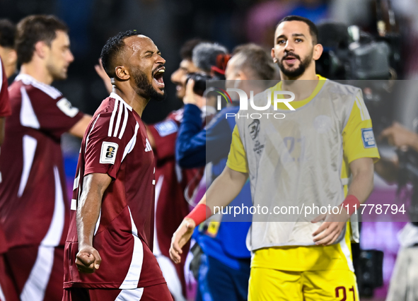 Ahmed Fathy (L) of Qatar celebrates after winning the FIFA World Cup 2026 AFC Asian Qualifiers third round group A match between Qatar and U...