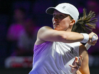 RIYADH, SAUDI ARABIA - NOVEMBER 05: Iga Swiatek of Poland during her match against Coco Gauff of USA, on day 4 of the 2024 WTA Finals, part...