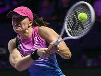 RIYADH, SAUDI ARABIA - NOVEMBER 07: Iga Swiatek of Poland during her match against Daria Kasatkina, on Day 6 of the 2024 WTA Finals, part of...