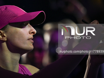 RIYADH, SAUDI ARABIA - NOVEMBER 07: Iga Swiatek of Poland with fans after winning her match against Daria Kasatkina, on Day 6 of the 2024 WT...