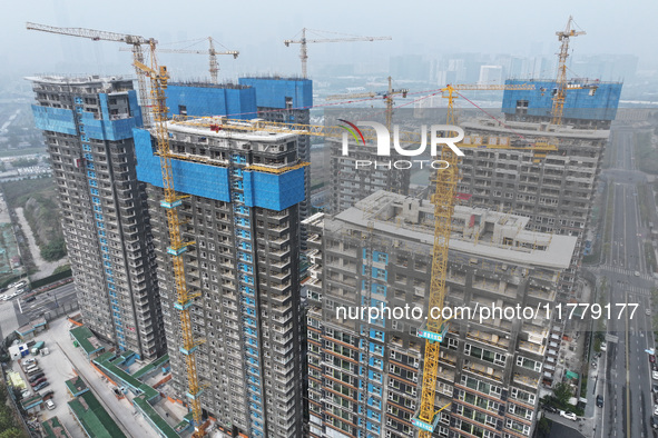 A building under construction by C&D Group is in Nanjing, China, on November 15, 2024. On November 15, 2024, the National Bureau of Statisti...