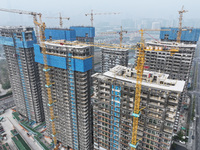 A building under construction by C&D Group is in Nanjing, China, on November 15, 2024. On November 15, 2024, the National Bureau of Statisti...