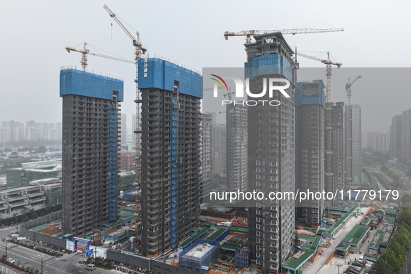 A building under construction by C&D Group is in Nanjing, China, on November 15, 2024. On November 15, 2024, the National Bureau of Statisti...