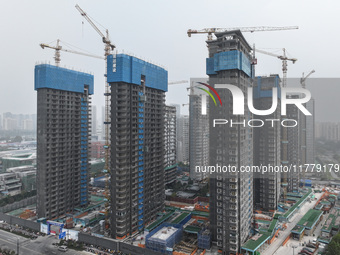 A building under construction by C&D Group is in Nanjing, China, on November 15, 2024. On November 15, 2024, the National Bureau of Statisti...