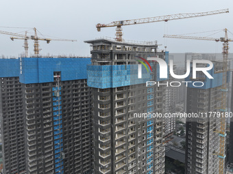 A building under construction by C&D Group is in Nanjing, China, on November 15, 2024. On November 15, 2024, the National Bureau of Statisti...