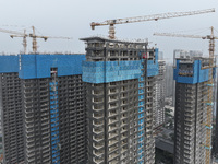 A building under construction by C&D Group is in Nanjing, China, on November 15, 2024. On November 15, 2024, the National Bureau of Statisti...