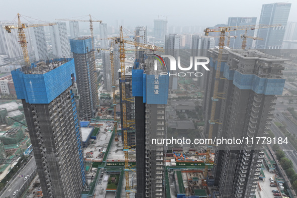 A building under construction by C&D Group is in Nanjing, China, on November 15, 2024. On November 15, 2024, the National Bureau of Statisti...