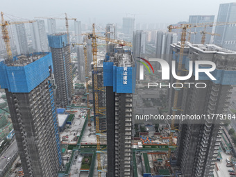 A building under construction by C&D Group is in Nanjing, China, on November 15, 2024. On November 15, 2024, the National Bureau of Statisti...