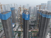 A building under construction by C&D Group is in Nanjing, China, on November 15, 2024. On November 15, 2024, the National Bureau of Statisti...