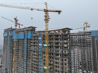 A building under construction by C&D Group is in Nanjing, China, on November 15, 2024. On November 15, 2024, the National Bureau of Statisti...