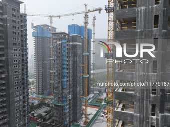 A building under construction by C&D Group is in Nanjing, China, on November 15, 2024. On November 15, 2024, the National Bureau of Statisti...