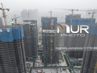 A building under construction by C&D Group is in Nanjing, China, on November 15, 2024. On November 15, 2024, the National Bureau of Statisti...