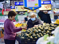 Consumers shop at a supermarket in Qingzhou, China, on November 15, 2024. On November 15, 2024, the National Bureau of Statistics releases d...