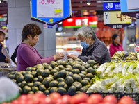 Consumers shop at a supermarket in Qingzhou, China, on November 15, 2024. On November 15, 2024, the National Bureau of Statistics releases d...