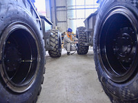 A worker works at a loader manufacturing enterprise in Qingzhou Economic Development Zone, East China's Shandong province, on November 15, 2...