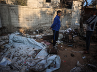 Palestinians inspect the site of an Israeli strike on tents of displaced people in Deir Al-Balah, Gaza Strip, on November 15, 2024. (