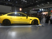 Visitors view a Xiaomi SU7 Ultra new energy vehicle at the 2024 Guangzhou Auto Show in Guangzhou, China, on November 15, 2024. (