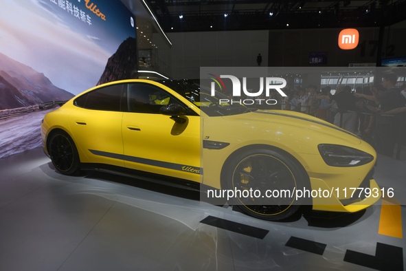 Visitors view a Xiaomi SU7 Ultra new energy vehicle at the 2024 Guangzhou Auto Show in Guangzhou, China, on November 15, 2024. 