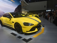 Visitors view a Xiaomi SU7 Ultra new energy vehicle at the 2024 Guangzhou Auto Show in Guangzhou, China, on November 15, 2024. (