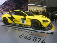 Visitors view a Xiaomi SU7 Ultra new energy vehicle at the 2024 Guangzhou Auto Show in Guangzhou, China, on November 15, 2024. (